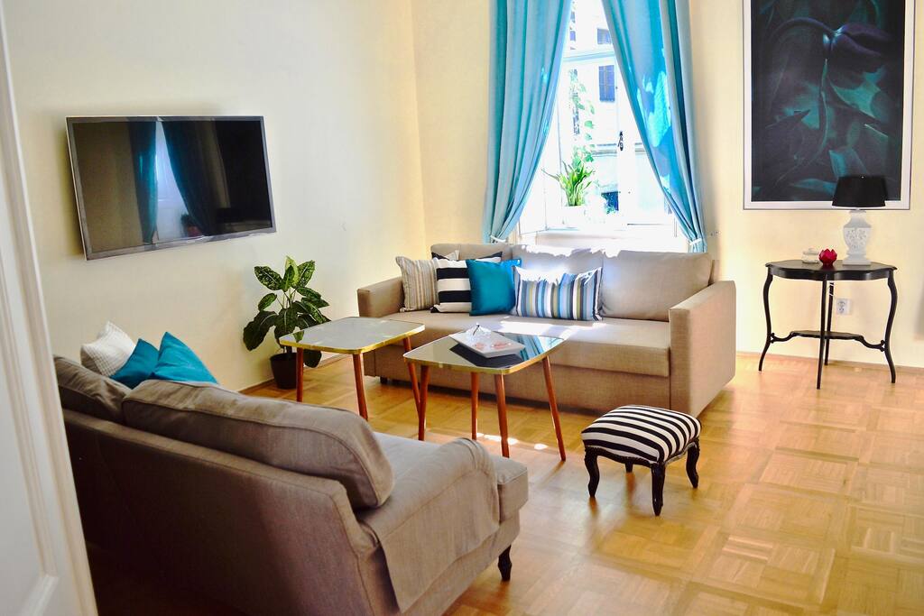 Spacious lounge area with two sofas with flat screen TV WIFI