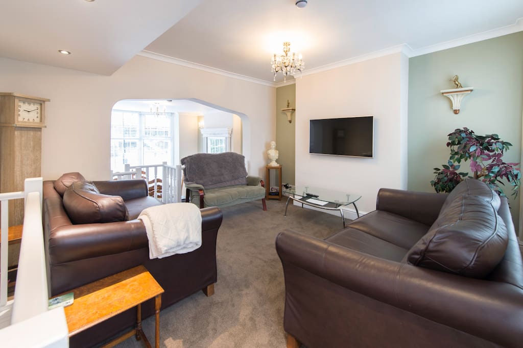 Relaxing sitting room with an extra dining room attached.