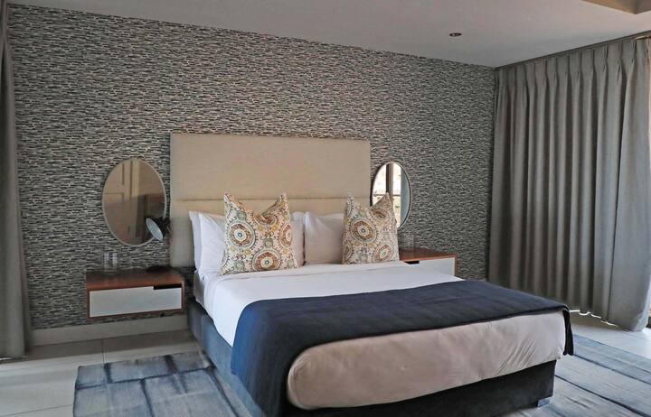 Third Bedroom with a queen size bed and its' own inter leading bathroom