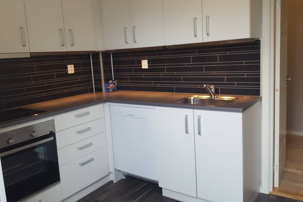 Romslig kjøkken - Spacious shared kitchen with own fridge.