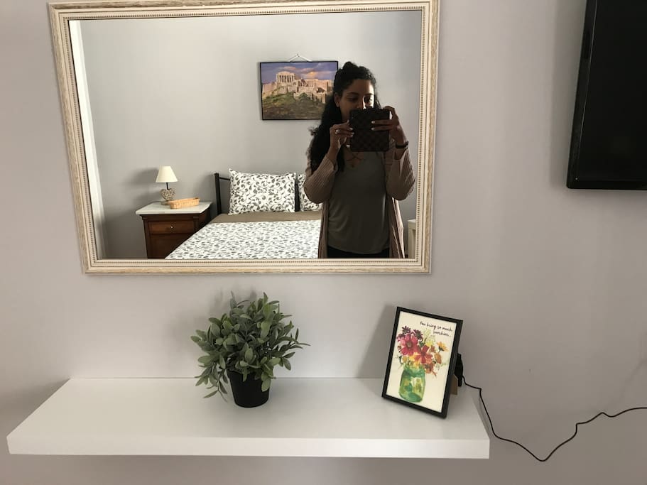 Mirror opposite of bed, and tv...