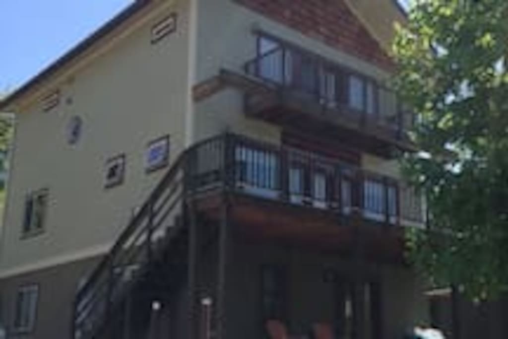 Cozy apt is on ground floor. I live in the upper two floors. The apt has a comfortable deck from which you can see some of Somers Bay and is bordered by berry bushes.