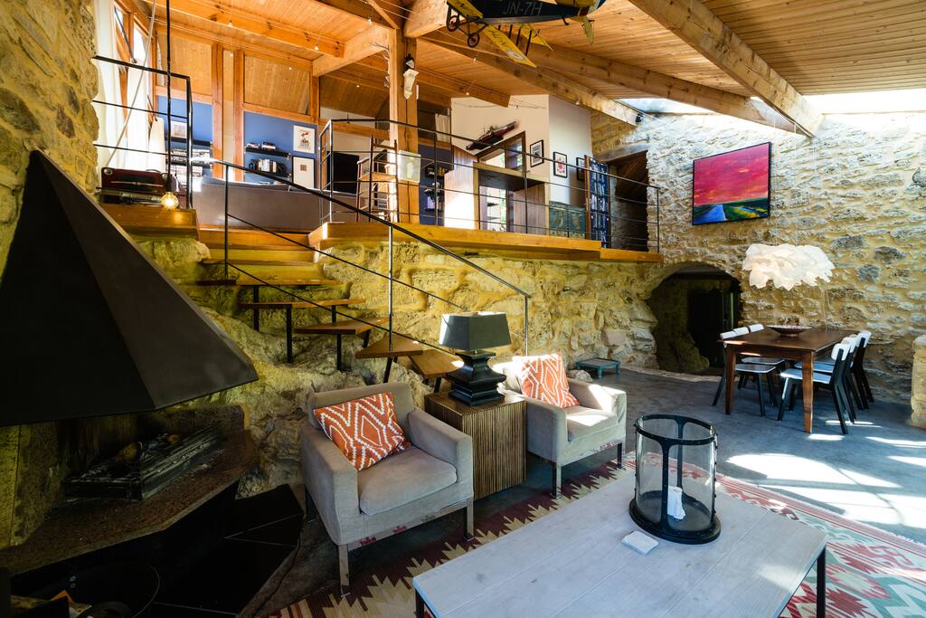 Sitting room with open fire and view to mezzanine