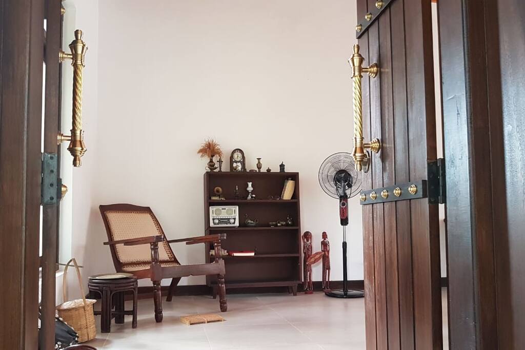 Relax on a traditional arm chair and read a book