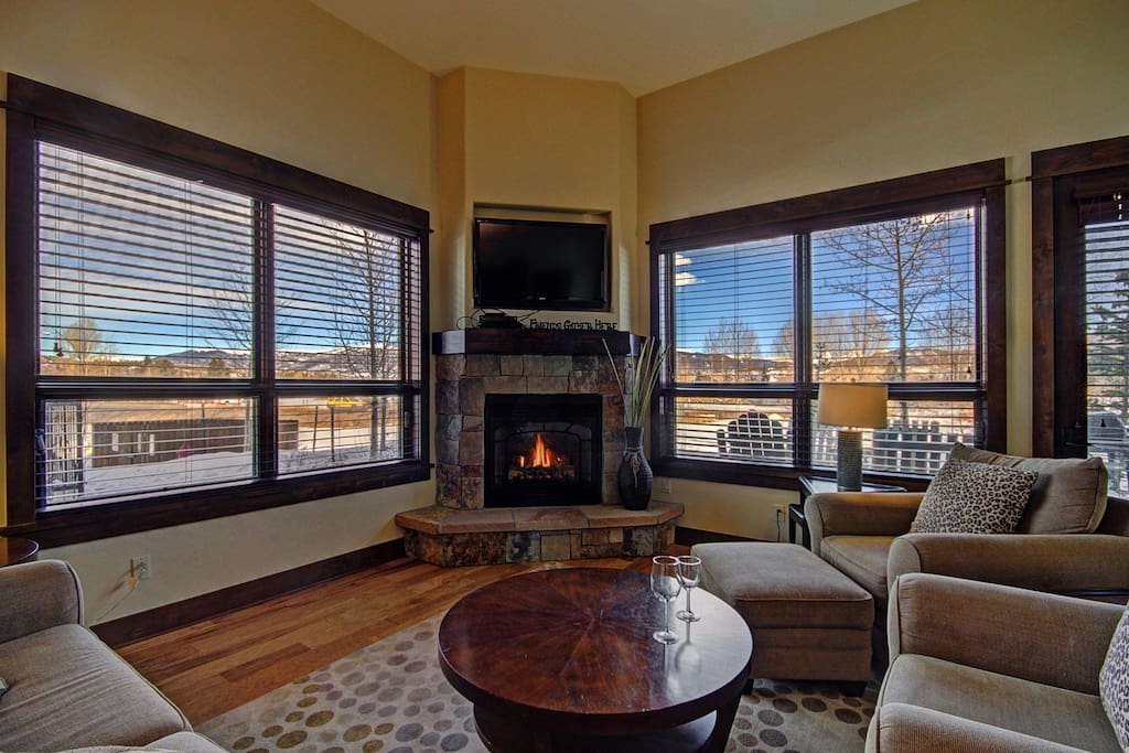 Living room with large windows - Enjoy the gorgeous views from the living area.