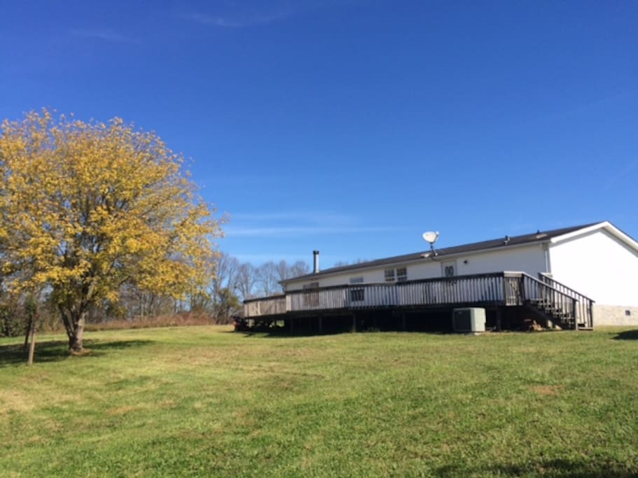 Large deck/patio area overlooking five acres.