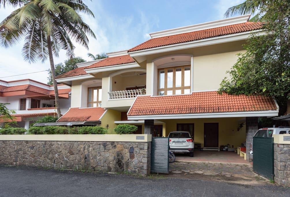 The view of the entire home from the approach road. Your private entrance door is the first on the right.
