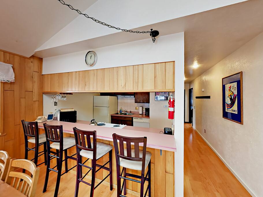 While dinner simmers, perch at the bar with seating for 4.