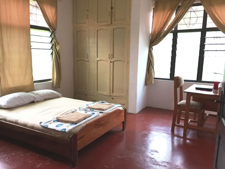 The room with bed, writing desk (with labtop for free use)