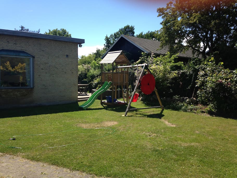 Private garden with terrasse for BBQ and a small playground.