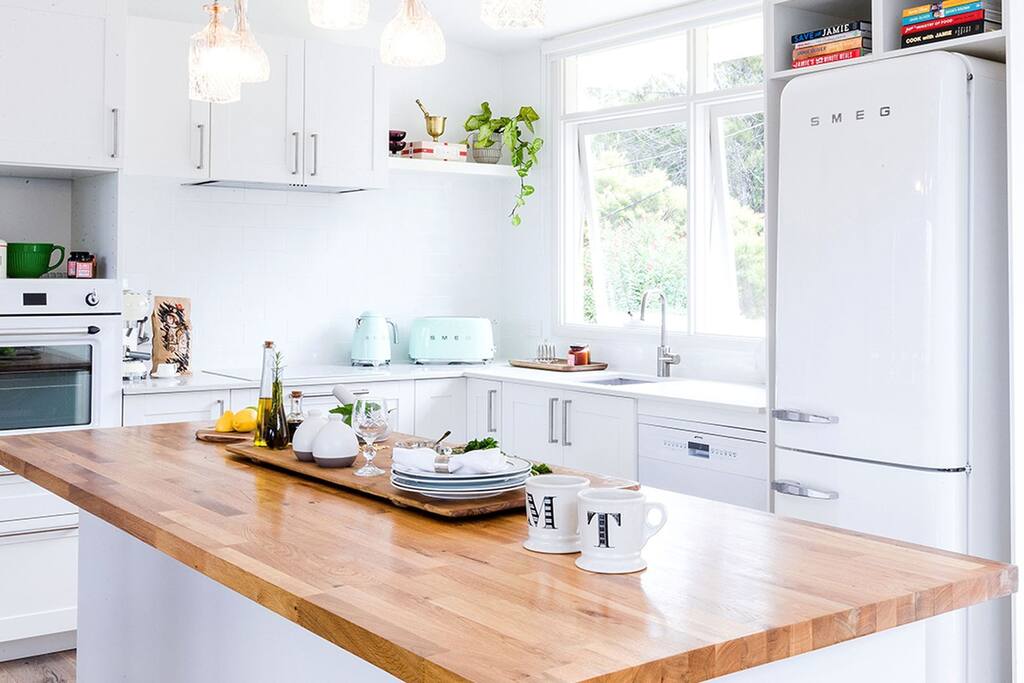 Create beautiful, healthy meals in the large and functional kitchen decked out in brand new SMEG appliances