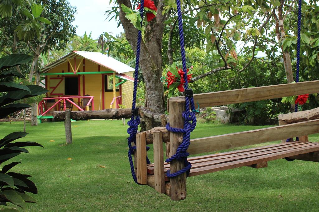 Swings in front of the house in the beautiful garden