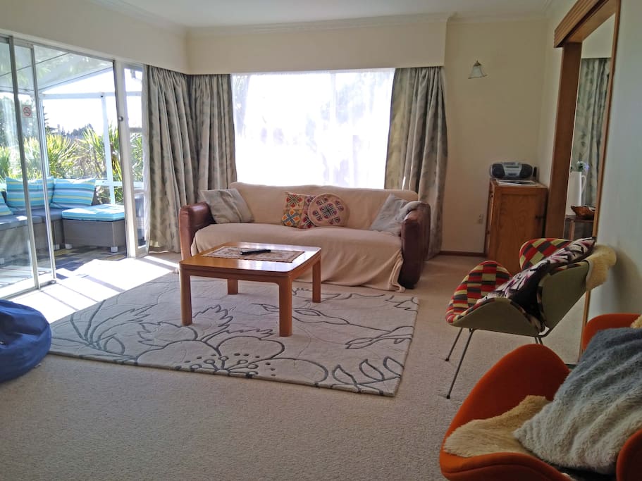 Large living space with sofa, chairs and beanbag