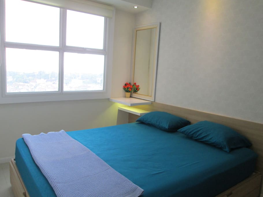 Enjoy the view while sleeping on a spacious bed