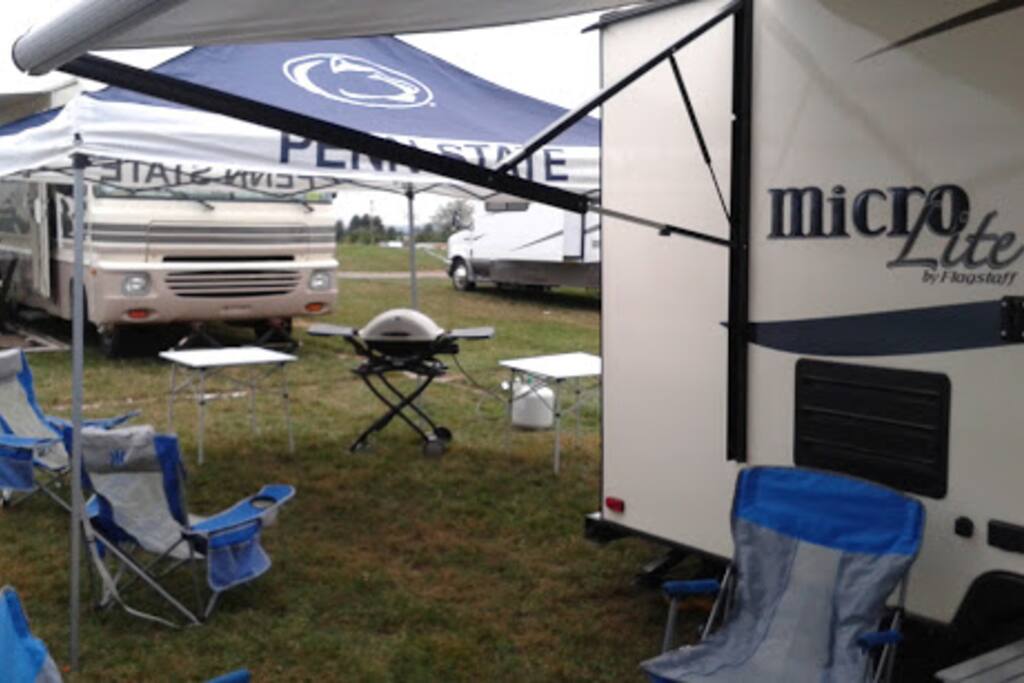 We have a full set-up for the perfect tailgating weekend! Awning with outdoor carpet, 6 chairs, multiple full size and side tables, PSU 10x10 canopy, a Weber grill, and more!