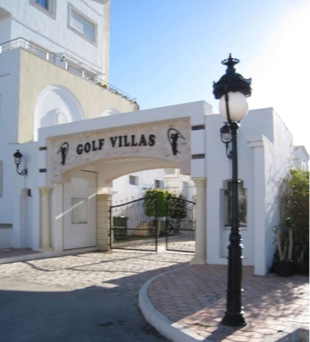 Gate of the villas near shops lounges