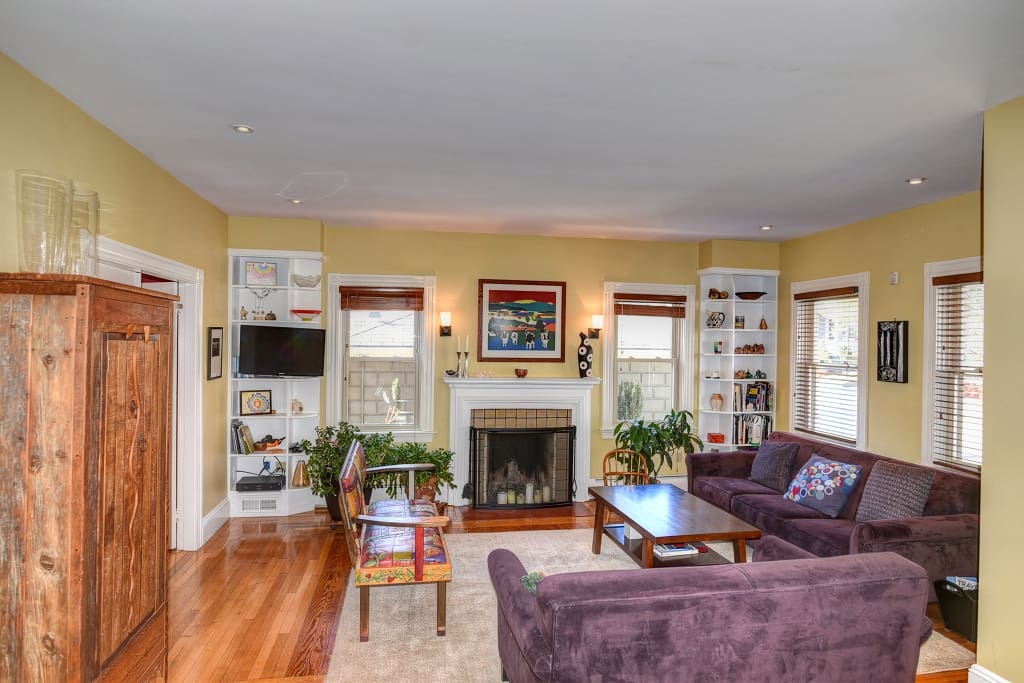Living room with flat screen TV/FIOS and fireplace.