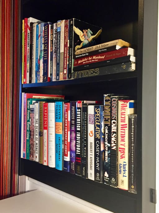 A bookcase with some of my current and older favorite books is built in above the workspace.