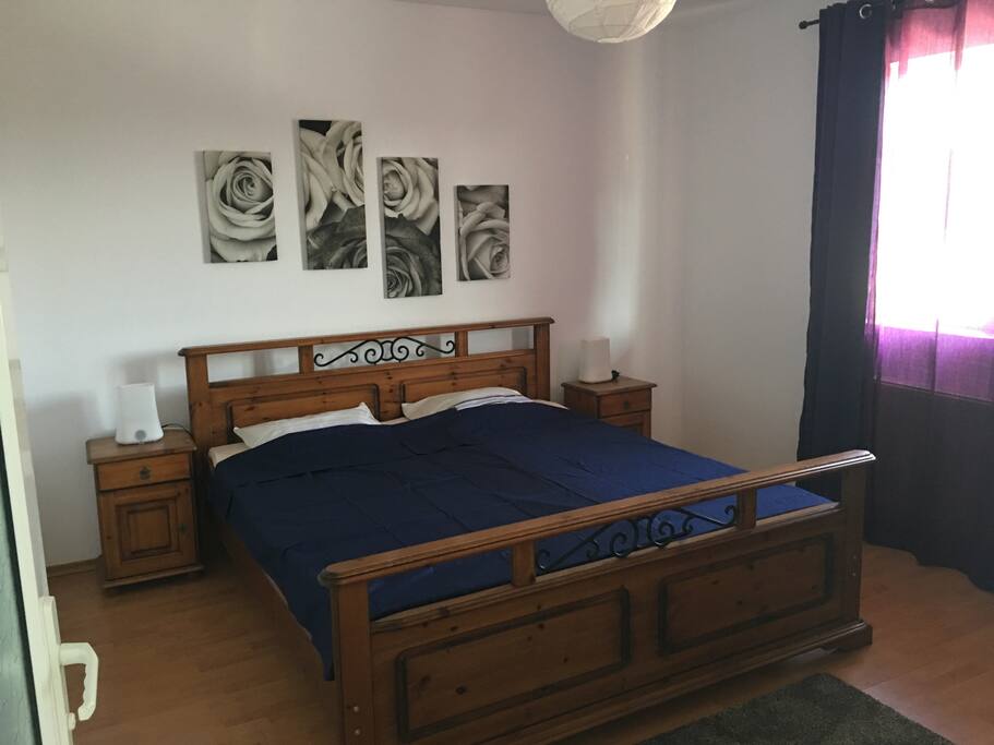 Main bedroom with large and comfortable bed and a mini-refrigerator to keep your drinks cold!