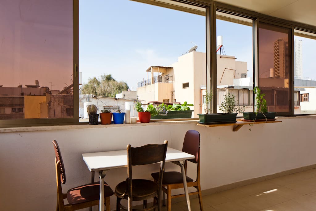 Soak up the sun on the balcony. We keep the windows open all year round - but in case of rain you can close them and still enjoy sitting outside.