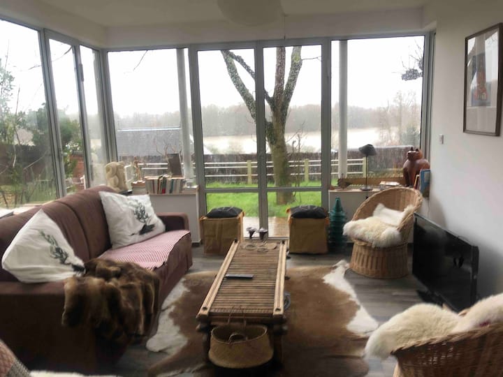 Living room in bow window overlooking the Loire 
