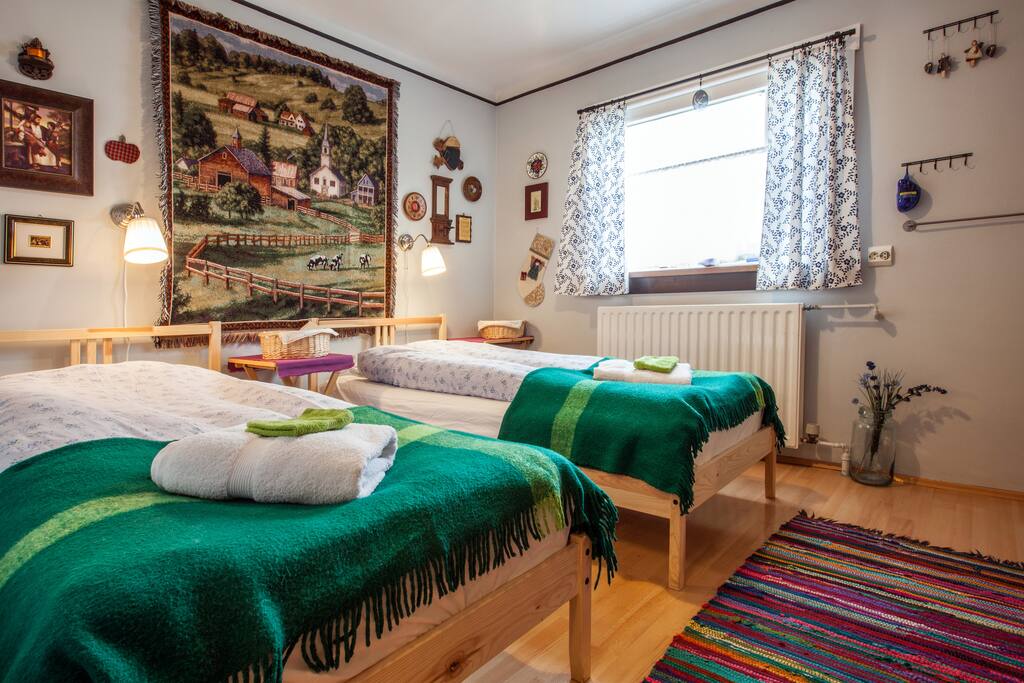 The East room, with it's two single beds. Beds can be put together making one giant bed for two.