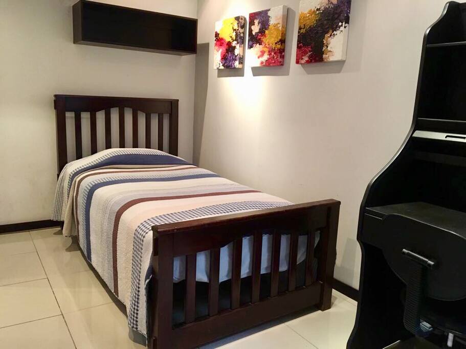 Second bedroom with comfortable desk.
