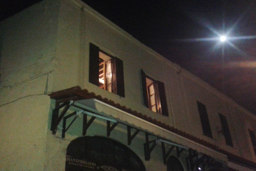 full moon and the front of the studio at night.