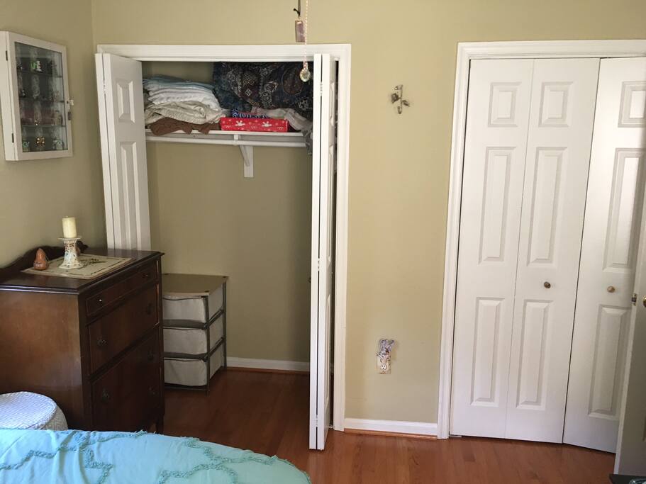 Two closets with hanging space.