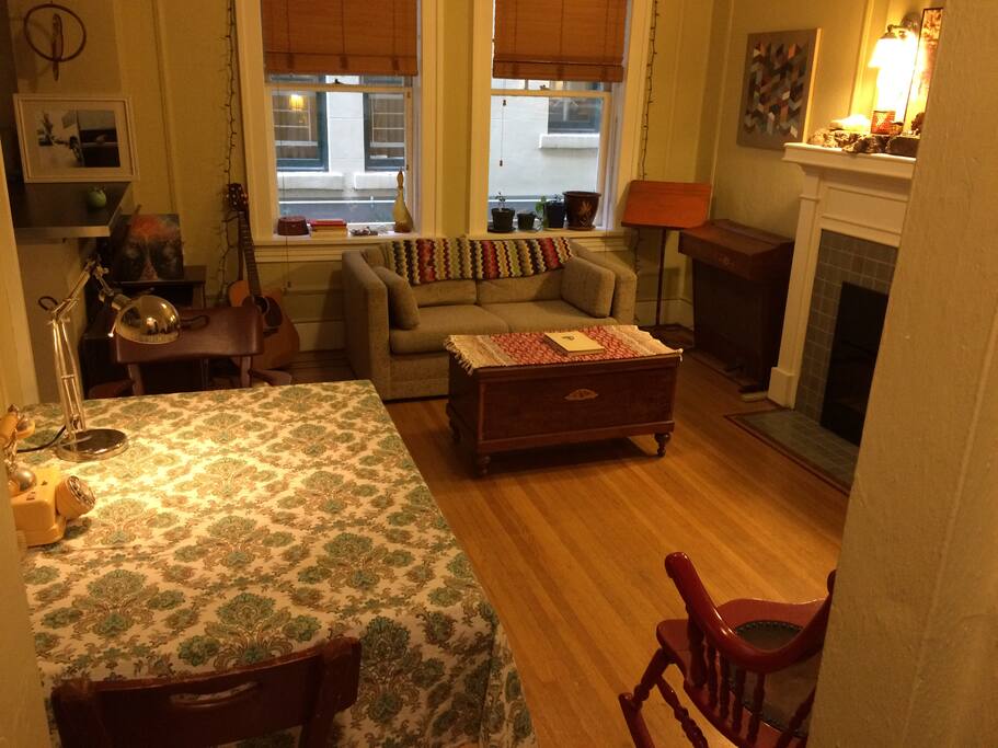 Lounging or living area with fireplace, record player and dining table
