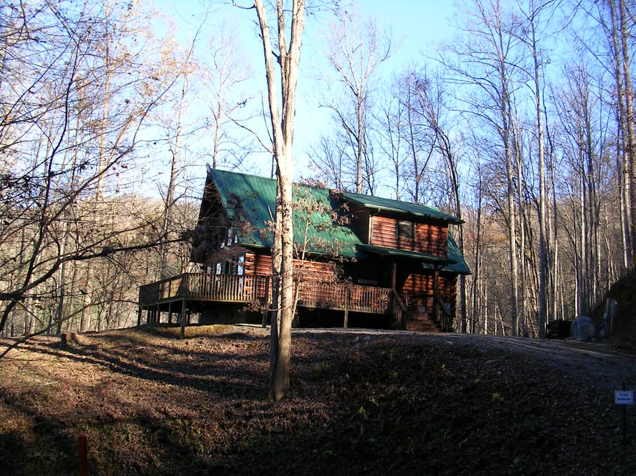 Paved roads to driveway with flat parking area.