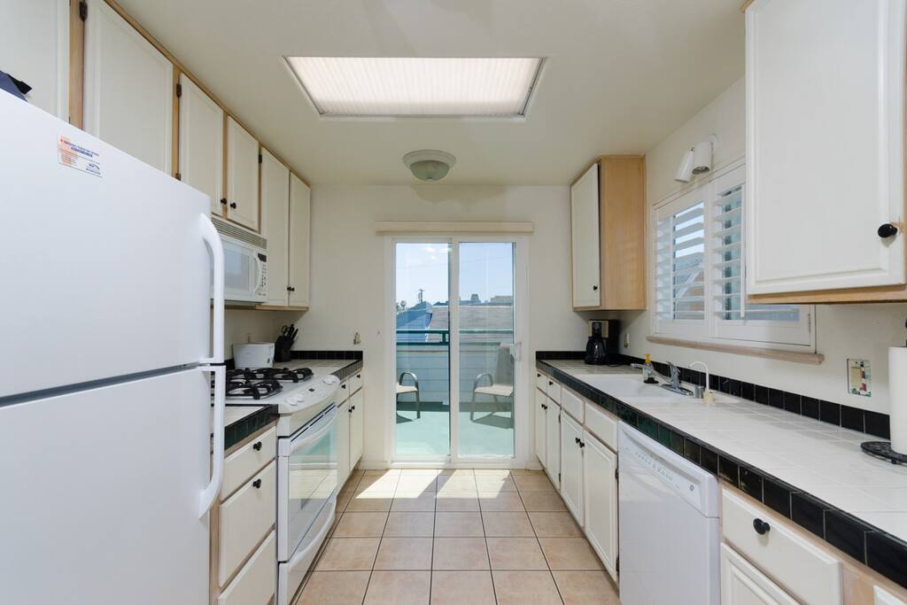 Kitchen with 2 small decks - one with Weber Gas BBQ