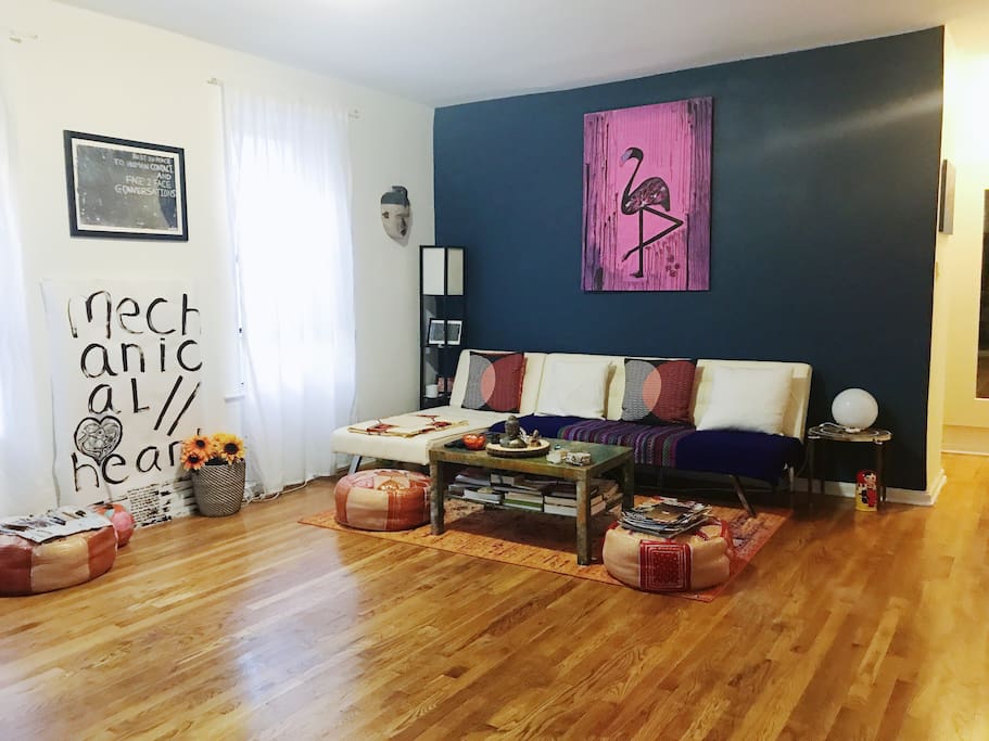 Spacious, and sunny living room with sofa bed for two.