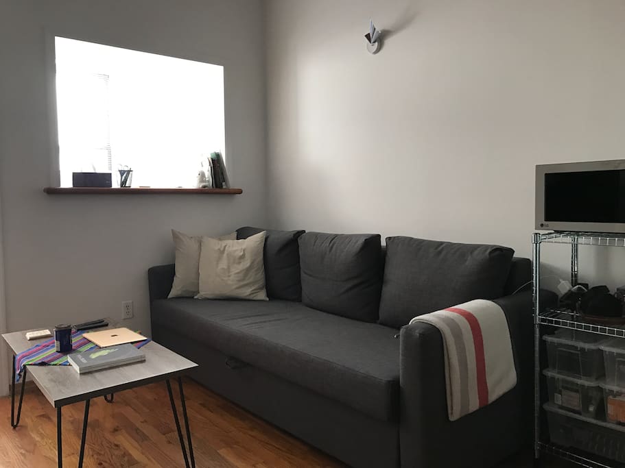 Sofa bed with a throw blanket
