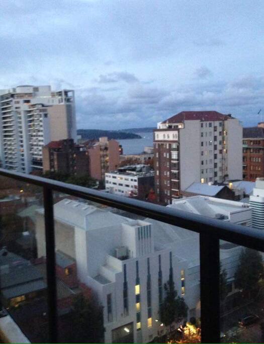 This is the view from your bedroom. You can see the boats coming in and out. We allow smoking on the balcony but NOT the apartment. Ash tray is provided outside.