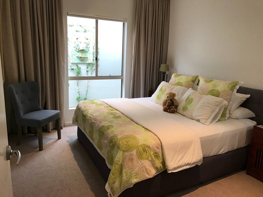 King size Bed with own private bathroom and powder room in separate wing of the house