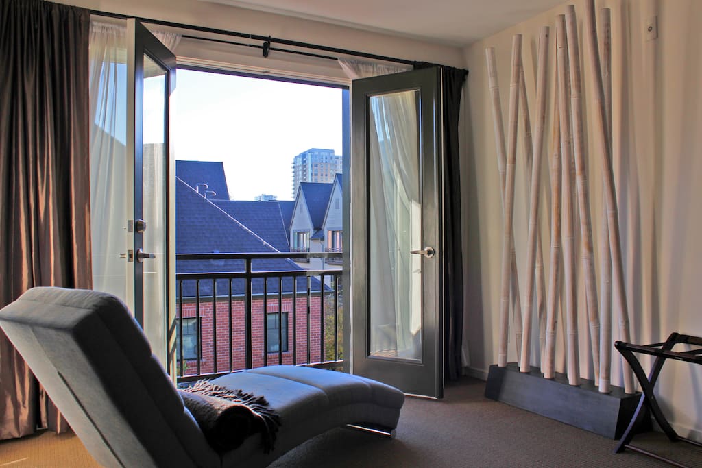 Catch up on your reading while lying on the chaise in the master suite overlooking the city through the Juliet balcony