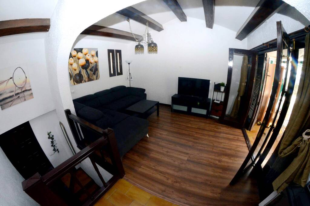 Spacious Living Room with Sofas and TV