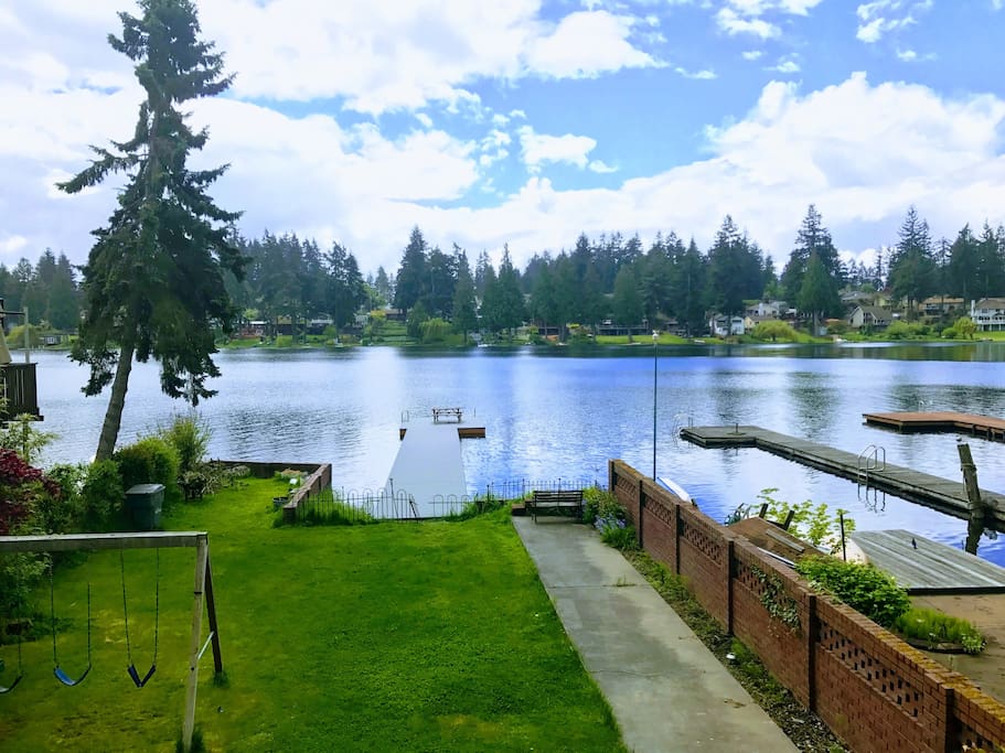 This is your view from the private patio overlooking the lake. You just need to take side stairs to go down to the backyard and lake/dock area.