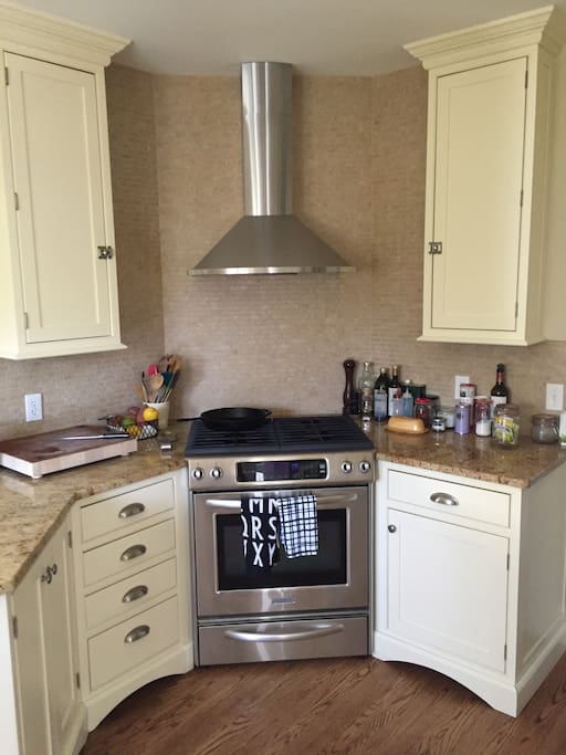 Recently updated kitchen with four-burner gas stove.