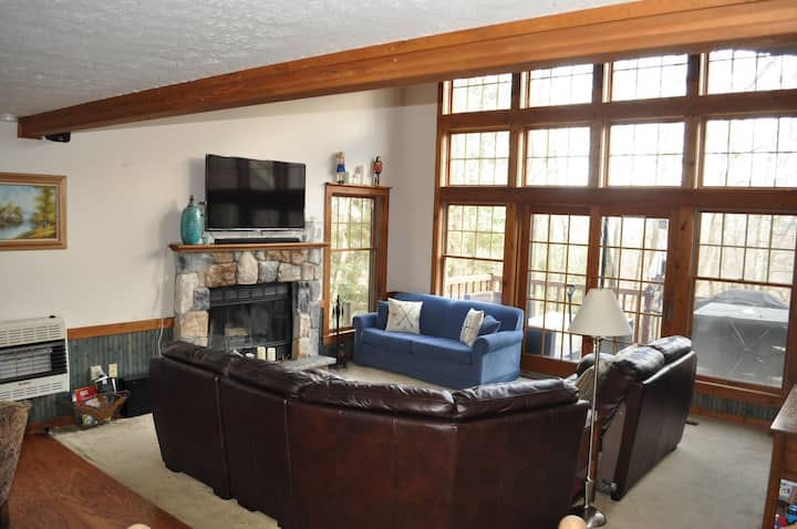 Airy, bright home with great views, real wood burning fireplace, large SmartTV with Bluetooth ready surround sound system, and comfy couches.  You may not want to leave to do anything outside...