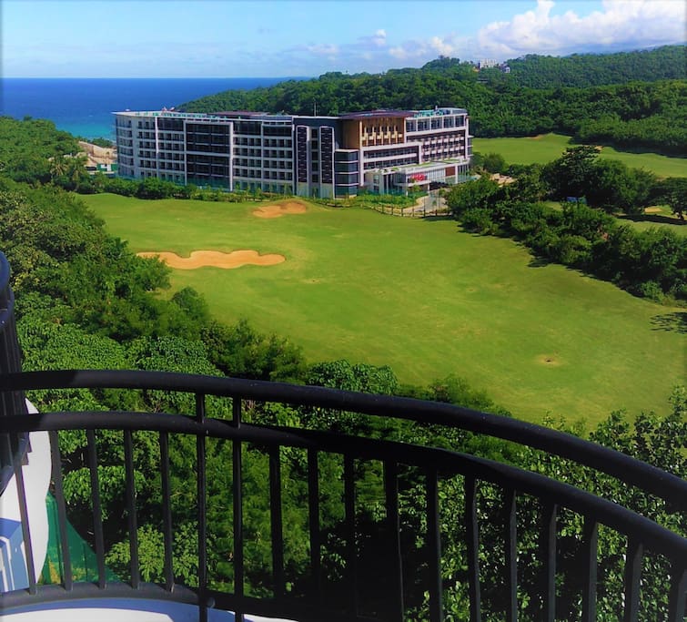 View of Savoy hotel, golf course and sea from private balcony