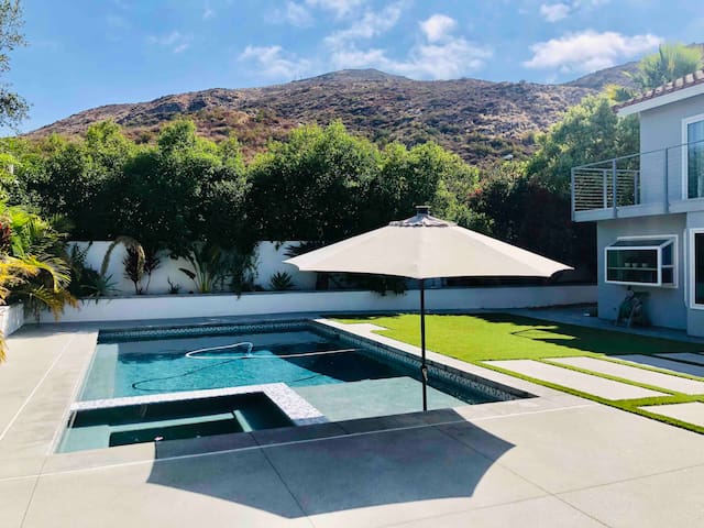 Bright and spacious home with views, pool & spa.