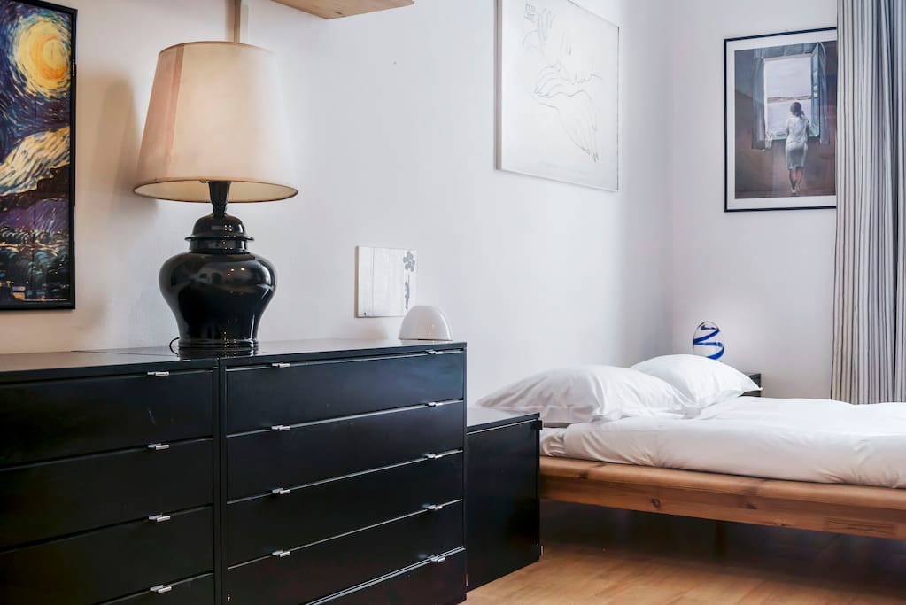 The Living area - The comfortable double bed with soft bed-linen and towels