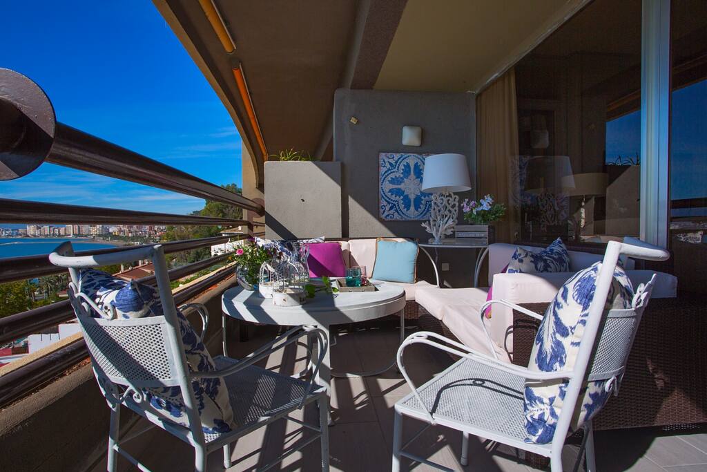 Beautiful terrace with cosy decor and stunning view.