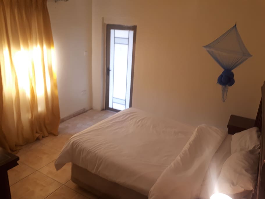 bed and main entrance to room