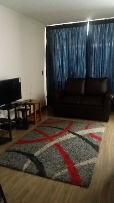 Sala de estar con sofá cama.Espacio de recreación con TV cable
