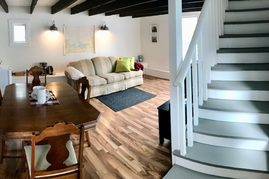 The main floor lounge offers a sofa, dining table and Apple TV with free Netflix. The lounge also has a fridge, toaster, coffee maker and tea kettle. Complimentary coffee and tea are provided by the host.