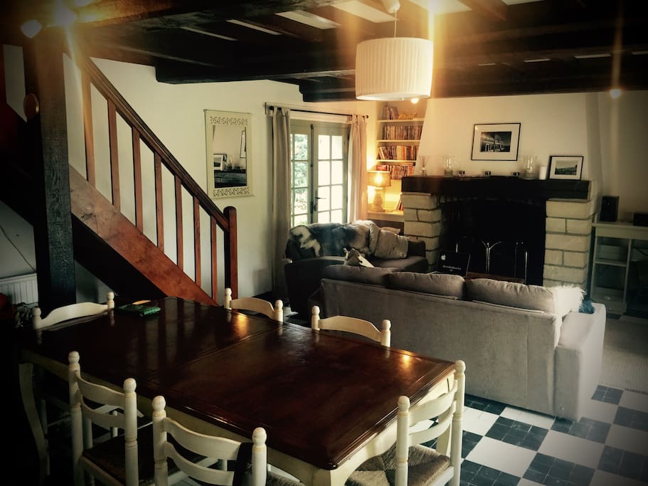 Massive norman fireplace and open plan lounge / dining room, complete with french doors front and back opening onto garden and full length terrace