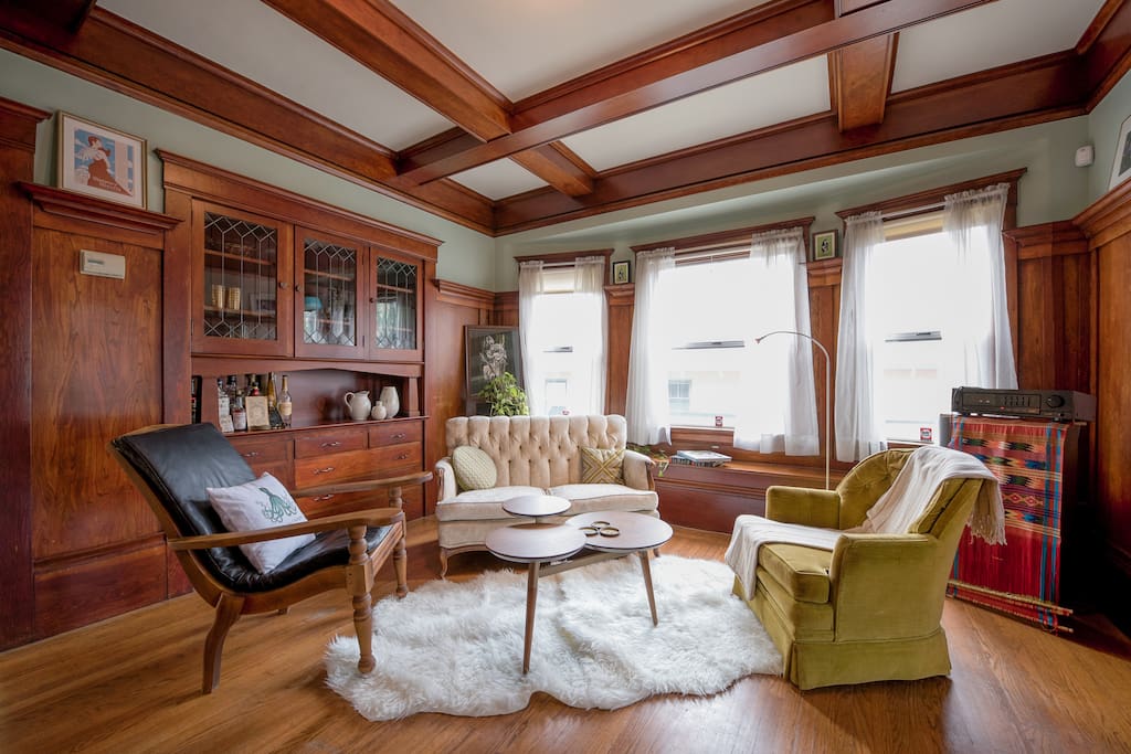 The sitting room features an intimate setting for visiting, reading, listening to music, etc. With an original art piece from the local muralist and graff artist Griffin One and more.